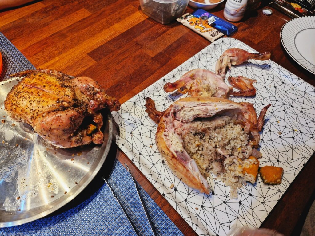 Raw rice inside a perfectly cooked smoked chicken BBQ