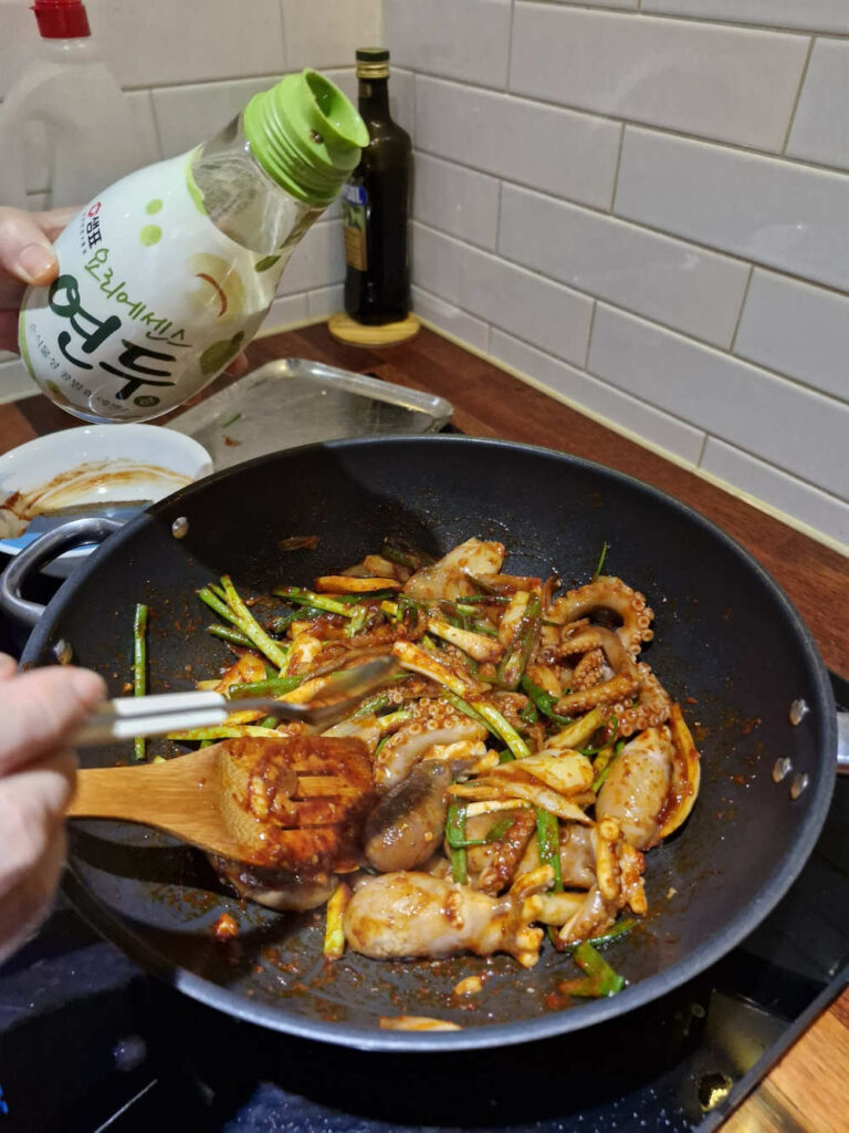 Tossing the octopus quickly over high heat