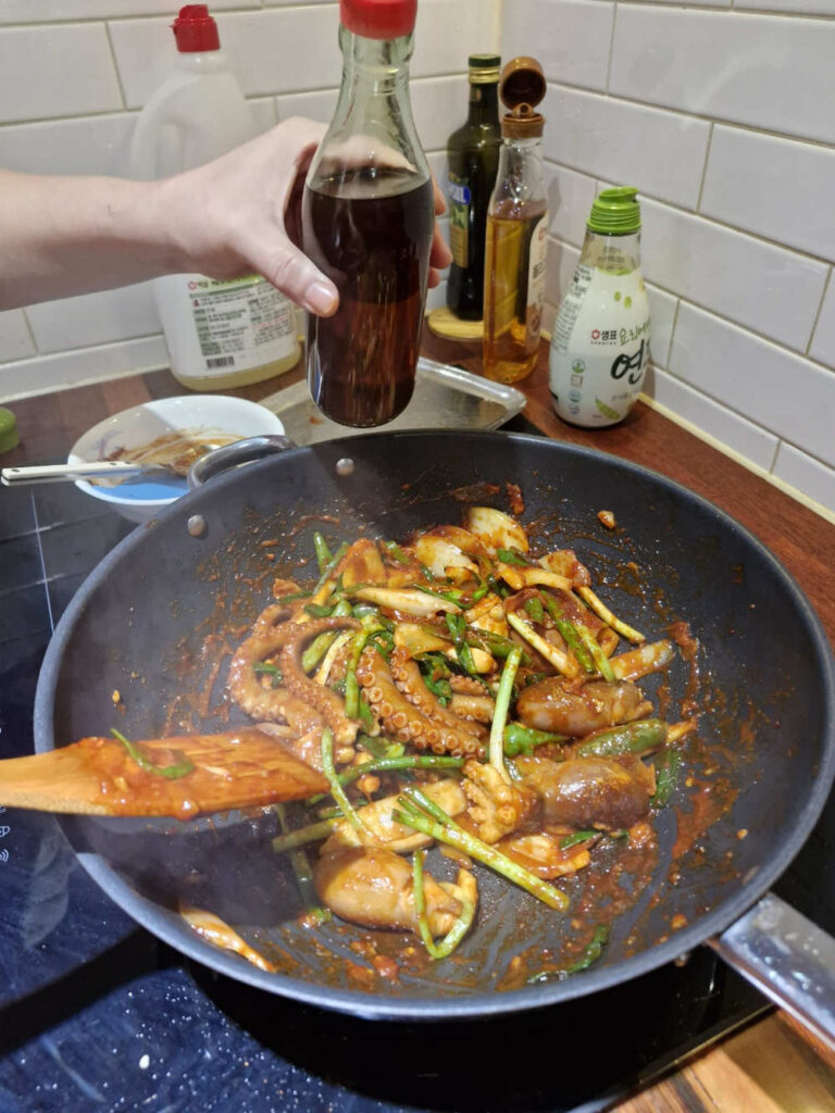 Final drizzle of sesame oil and seeds