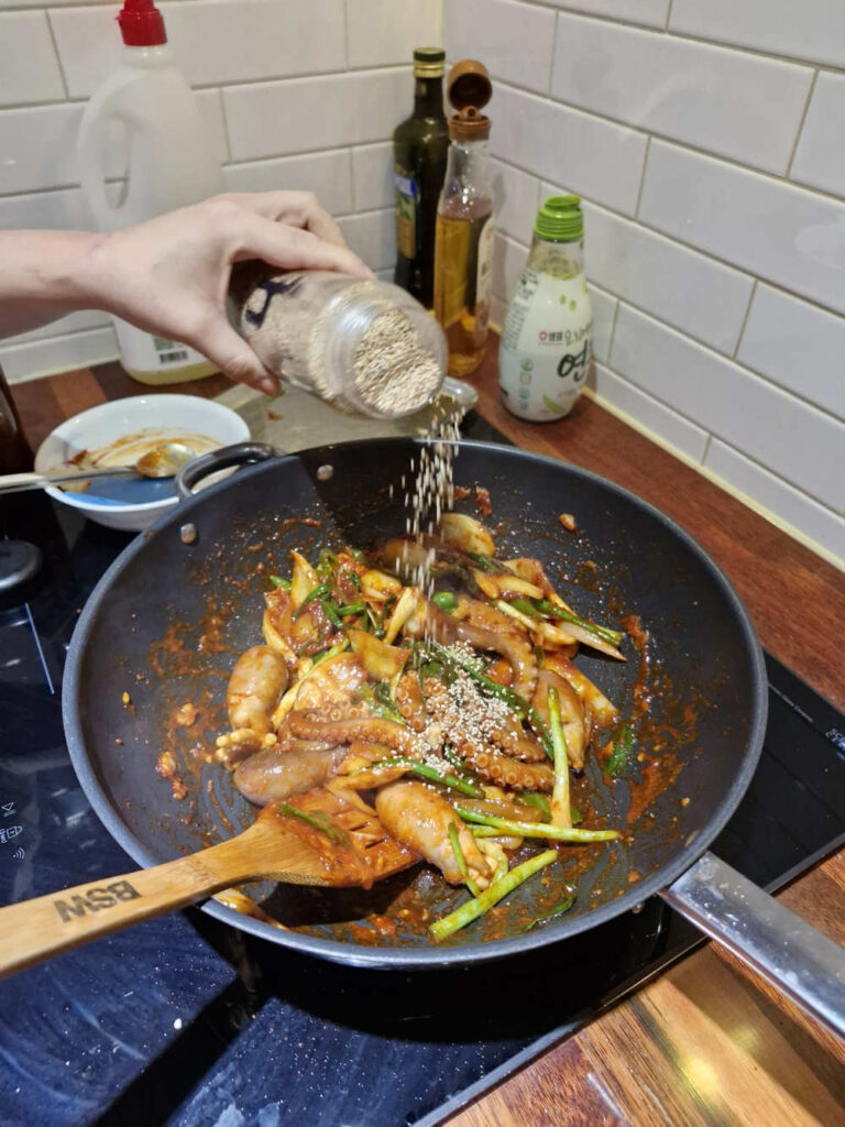 Final drizzle of sesame oil and seeds