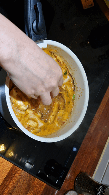 Adding fresh tofu to the boiling Doenjang-jjigae