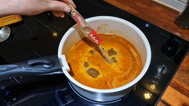 Seasoning the stew with Dashida umami powder