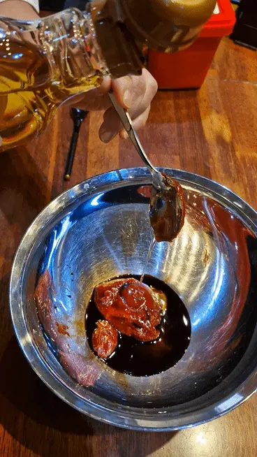 Squeezing clear oligosaccharide syrup into the seasoning mix