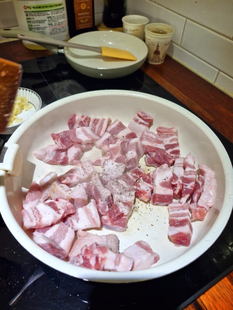 adding-pepper-to-pork