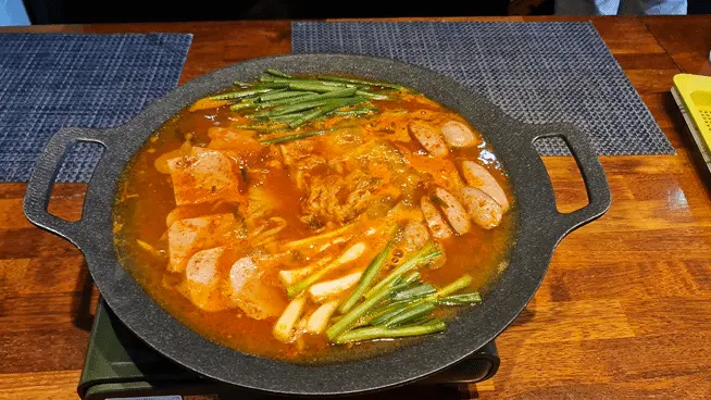 Close-up of bubbling Budae-jjigae (Army Stew)