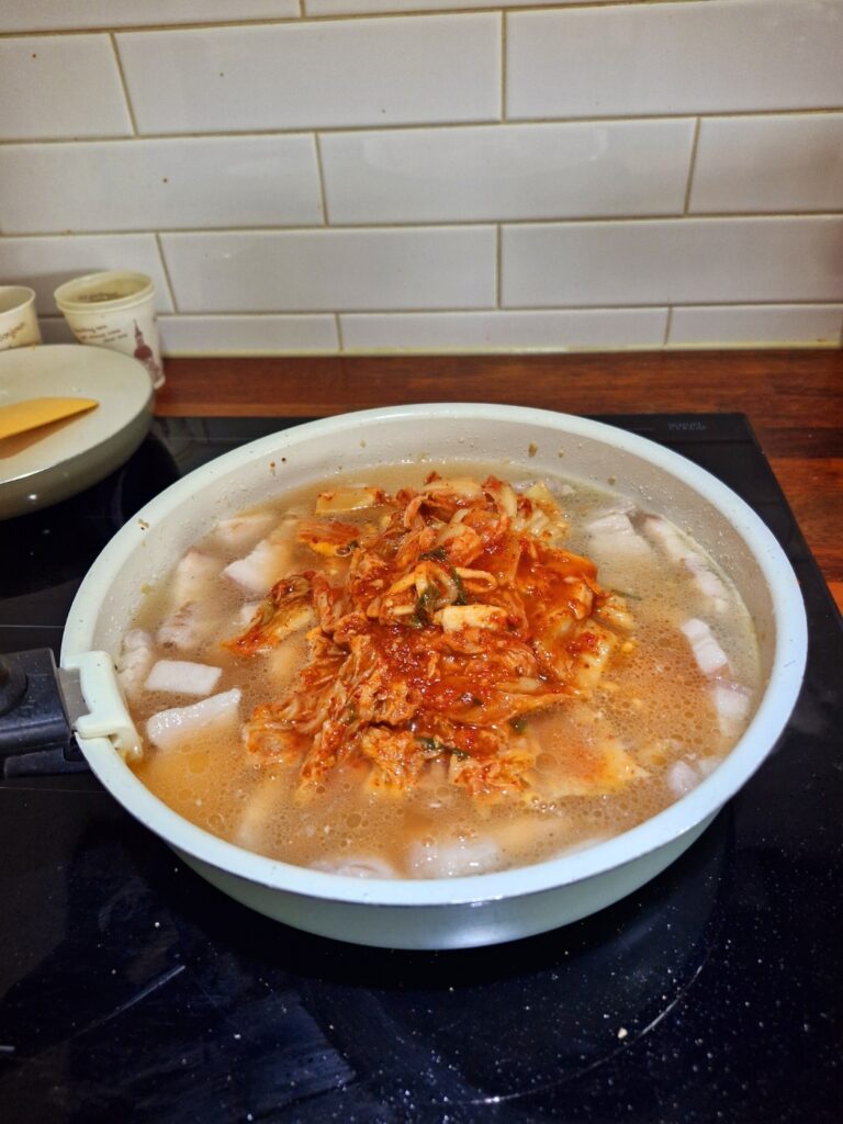 adding-kimchi-to-pot