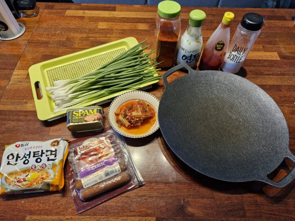 All ingredients for easy Budae-jjigae on a table
