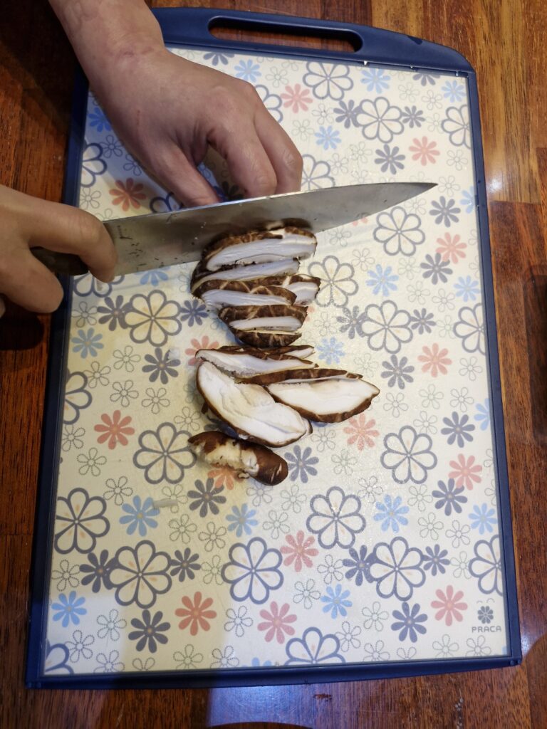 Adding mushrooms to soybean paste stew