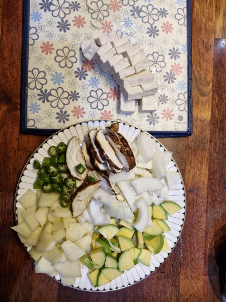 All prepared vegetables and tofu on a plate