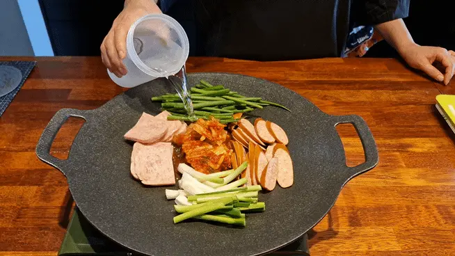 Pouring 1 liter of water into the pot