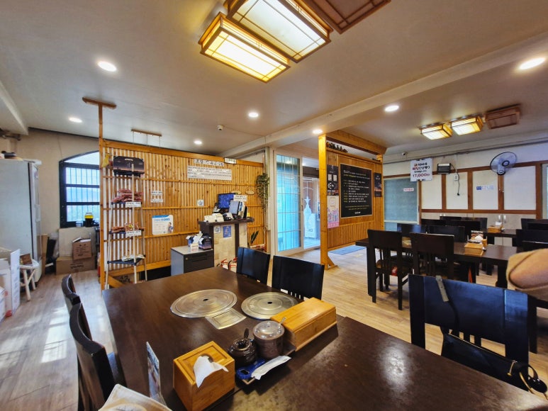 Spacious and clean interior hall of the restaurant, perfect for family dining.