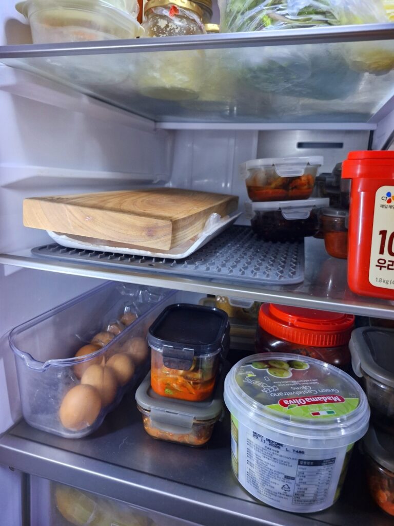 Marinated salmon wrapped and curing in the refrigerator