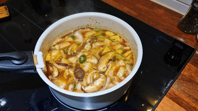 Bubbling Korean soybean paste stew in a pot