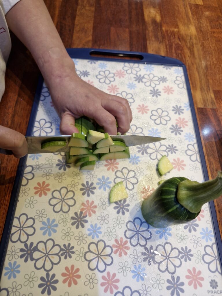 Slicing zucchini for authentic Korean stew